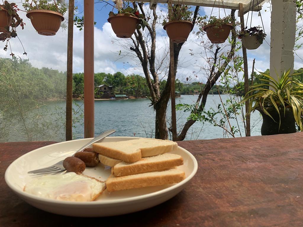 Breakfast plate with eggs and toast, with lake view from the pavilion